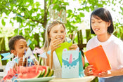 children enjoying party gift bags