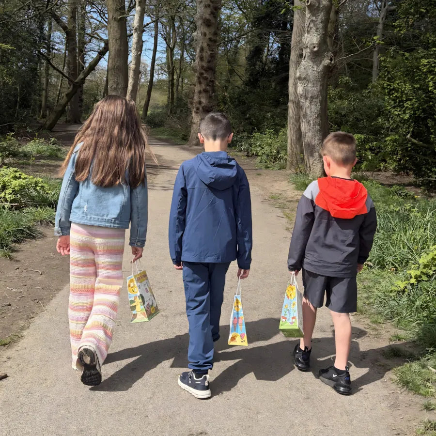Kids walking with colouring lunch bags