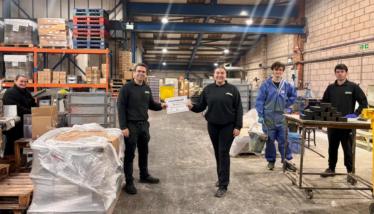 The Keeko team on the factory floor with UK small business awards finalist certificate